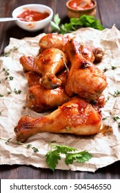 Roasted Chicken Drumstick On Paper.