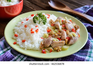 Roasted chicken meat with stalk celery, roasted walnuts and rice