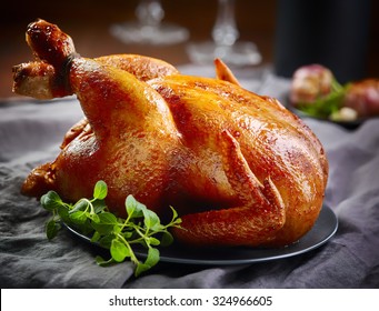 roasted chicken on gray plate - Shutterstock ID 324966605