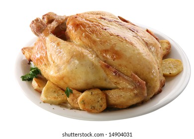 Roasted chicken on isolated white background, with potatoes - Shutterstock ID 14904031