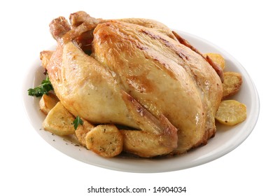 Roasted chicken on isolated white background, with potatoes - Shutterstock ID 14904034