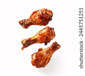 Roasted chicken wings with spices and herbs, flying isolated on white background. floating BBQ chicken drumsticks with vegetables isolated on white background. fried chicken wings.