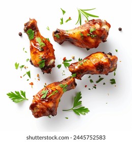 Roasted chicken wings with spices and herbs, flying isolated on white background. floating BBQ chicken drumsticks with vegetables isolated on white background. fried chicken wings. - Powered by Shutterstock