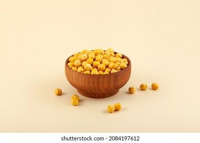 Roasted Chickpea Or Leblebi In Wooden Bowl On Beige Background. Turkish Snack. Selective Focus, Copy Space.