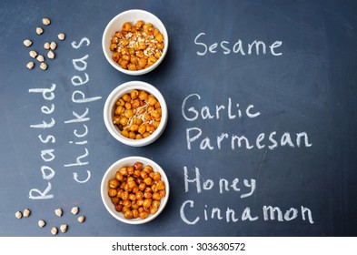roasted chickpeas in different flavors on a black background. the toning. selective focus - Shutterstock ID 303630572