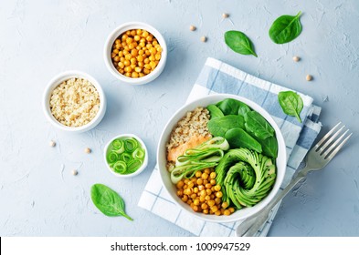 Roasted Chickpeas Spinach Quinoa Avocado Cucumber Buddha bowl. toning. selective focus