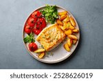 Roasted cod, codfish with baked potatoes and cherry tomatoes on plate. Grey background. Close up. Top view.