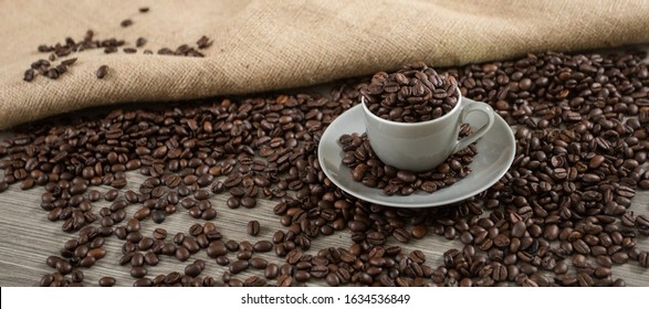 Roasted Coffee Beans In A Caffee Mug