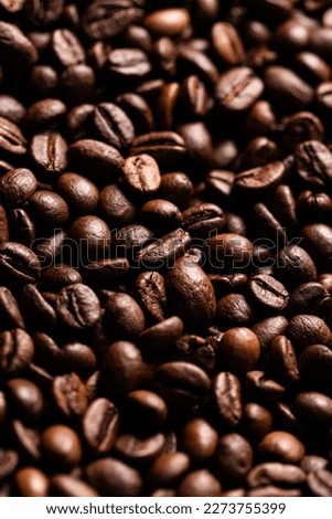 Roasted coffee beans close up background 