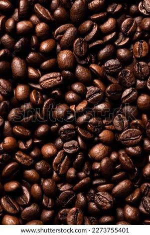 Roasted coffee beans close up background 