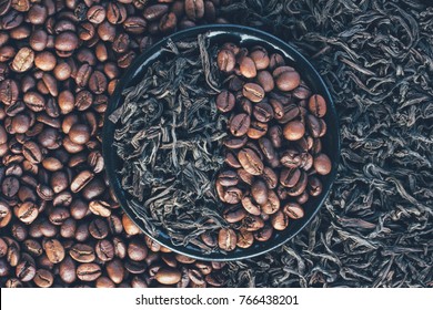 Roasted Coffee Beans And Dry Leaves Of Black Tea, Top View Closeup