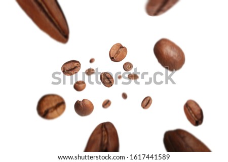 
roasted coffee beans fly from top to bottom with a motion effect on a white background
