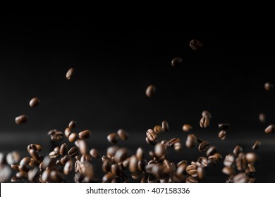 A Lot Of Roasted Coffee Beans Flying In The Air