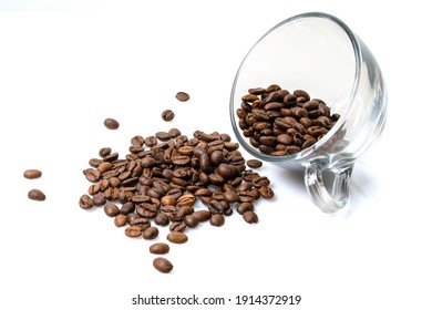 roasted coffee beans in a glass cup isolated on a white background