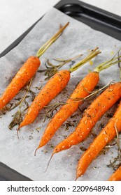 Roasted Cooked Baked Carrots On Baking Tray, Top View, Overhead. Healthy Vegan Food.