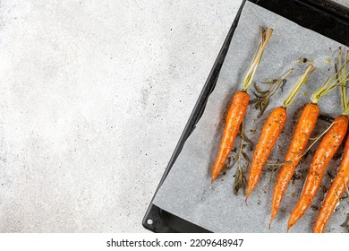 Roasted Cooked Baked Carrots On Baking Tray, Top View, Overhead. Healthy Vegan Food.