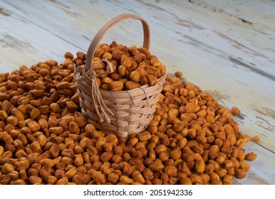 Roasted corn nuts in a jute basket,roasted corns in a jute basket and piles of corns around,