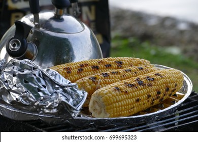 Roasted corn with teapot