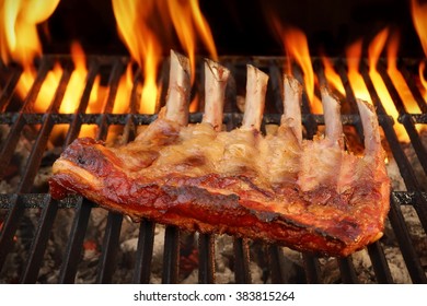 Roasted Country Style Baby Back Or Spare Ribs On The Hot Flaming BBQ Grill, Close-up