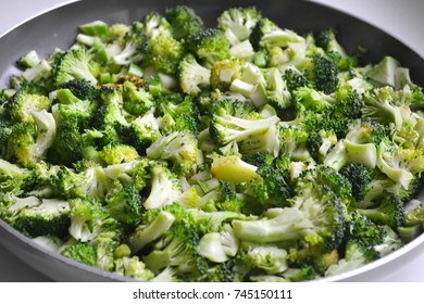 Roasted And Cut Fresh Healthy Broccoli Cabbage In A Pan On White Background