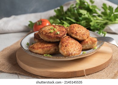 Roasted Cutlets On Plate With Fork. Side View.