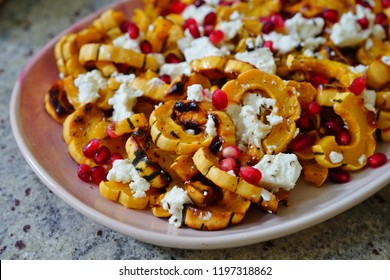 Roasted Delicata Squash Salad With Goat Cheese And Pomegranate In The Fall