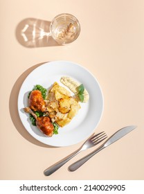 Roasted Duck Confit Served On White Plate Top View On Beige Background