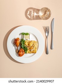 Roasted Duck Confit Served On White Plate Top View On Beige Background