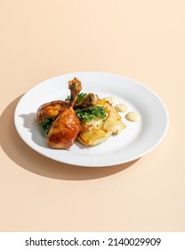 Roasted Duck Confit Served On White Plate Top View On Beige Background