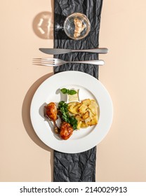 Roasted Duck Confit Served On White Plate Top View On Beige Background