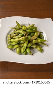 Roasted Edamame On A White Plate