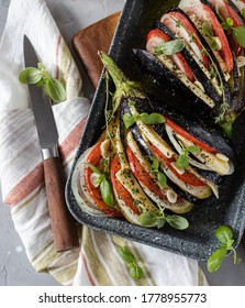 Roasted Eggplant Fan With Tomatoes, Onions, Mozzarella Cheese, Basil Leaves And Spices