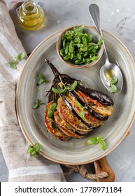 Roasted Eggplant Fan With Tomatoes, Onions, Mozzarella Cheese, Basil Leaves And Spices