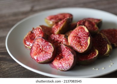 Roasted Fig Halves Served With A Drizzle Of Honey. Roasting Is Done Using An Air Fryer. Shot On Rustic Wooden Background