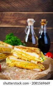 Roasted French Toast With Ham, Egg, Herbs And Cheese Cheddar. Delicious Grilled Breakfast Sandwich