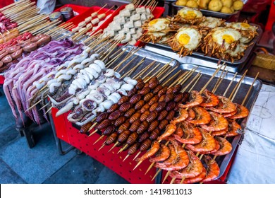 Roasted, Fried And Raw Insects, Silkworms, Scorpions, Bugs, Snakes, Dog Meat, Octopus On Stick As Snack Street Food In China