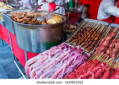 Roasted, Fried And Raw Insects, Silkworms, Scorpions, Bugs, Snakes, Dog Meat, Octopus On Stick As Snack Street Food In China