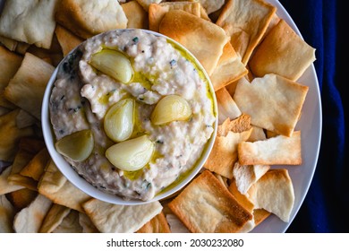 Roasted Garlic And Rosemary White Bean Dip: Dip Made From Cannellini Beans, Olive Oil, And Roasted Garlic Served With Pita Chips