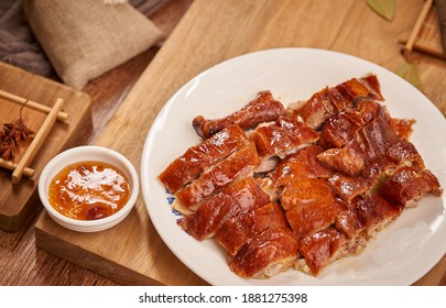 The Roasted Golden Goose Is Cut Into Pieces And Placed On A Plate