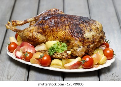 Roasted Goose On Wooden Table