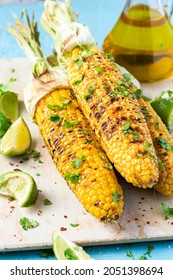 Roasted Or Grilled Sweet Corn Cobs With Garlic, Coriander, Lime . Mexican Street Food. Top Down View.