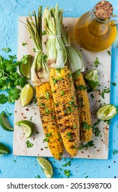 Roasted Or Grilled Sweet Corn Cobs With Garlic, Coriander, Lime . Mexican Street Food. Top Down View.