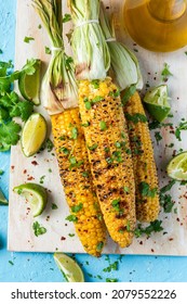 Roasted Or Grilled Sweet Corn Cobs With Garlic, Coriander, Lime . Mexican Street Food. Top Down View.