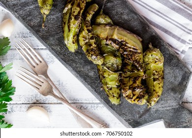 Roasted Hatch Chili Peppers On The Cutting Board. Fall Harvest. Summer Menu. Rustic Style. Vegetarian Menu. Green Chilies. Hatch Chile Festival.