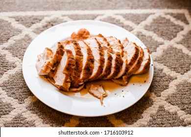 Roasted Juicy Sliced Turkey Breast On White Plate