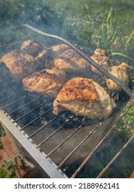 Roasted Meat With A Golden Crust On A Smoky Grill