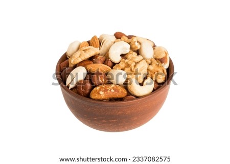 Roasted mix nut in bowl isolated on white background. mix nut is snack or raw of cook. Healthy food concept. [[stock_photo]] © 
