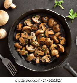 Roasted mushroom in cast iron pan over dark stone background. Vegetarian vegan food concept. Top view, flat lay - Powered by Shutterstock