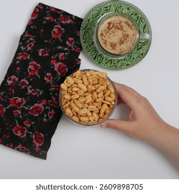 Roasted Nuts with Cup and Hand