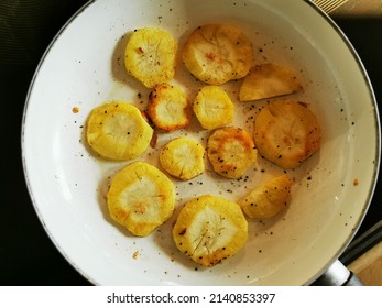 Roasted Parsnip Slices In A Pan.